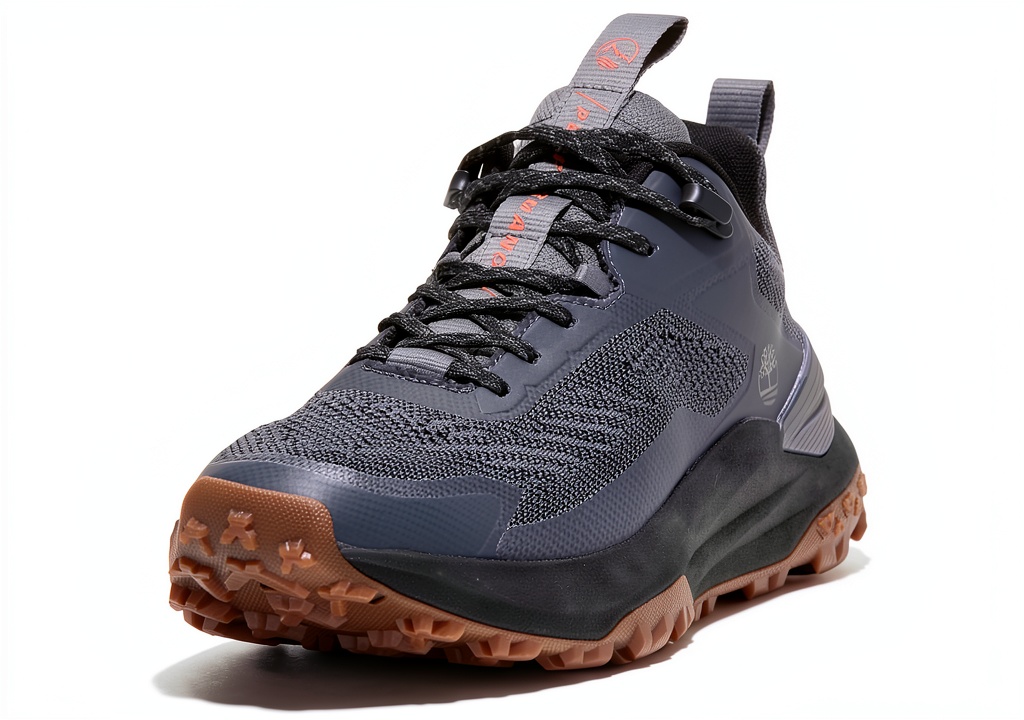 Timberland hiking shoes on a rocky trail showcasing leather and mesh design